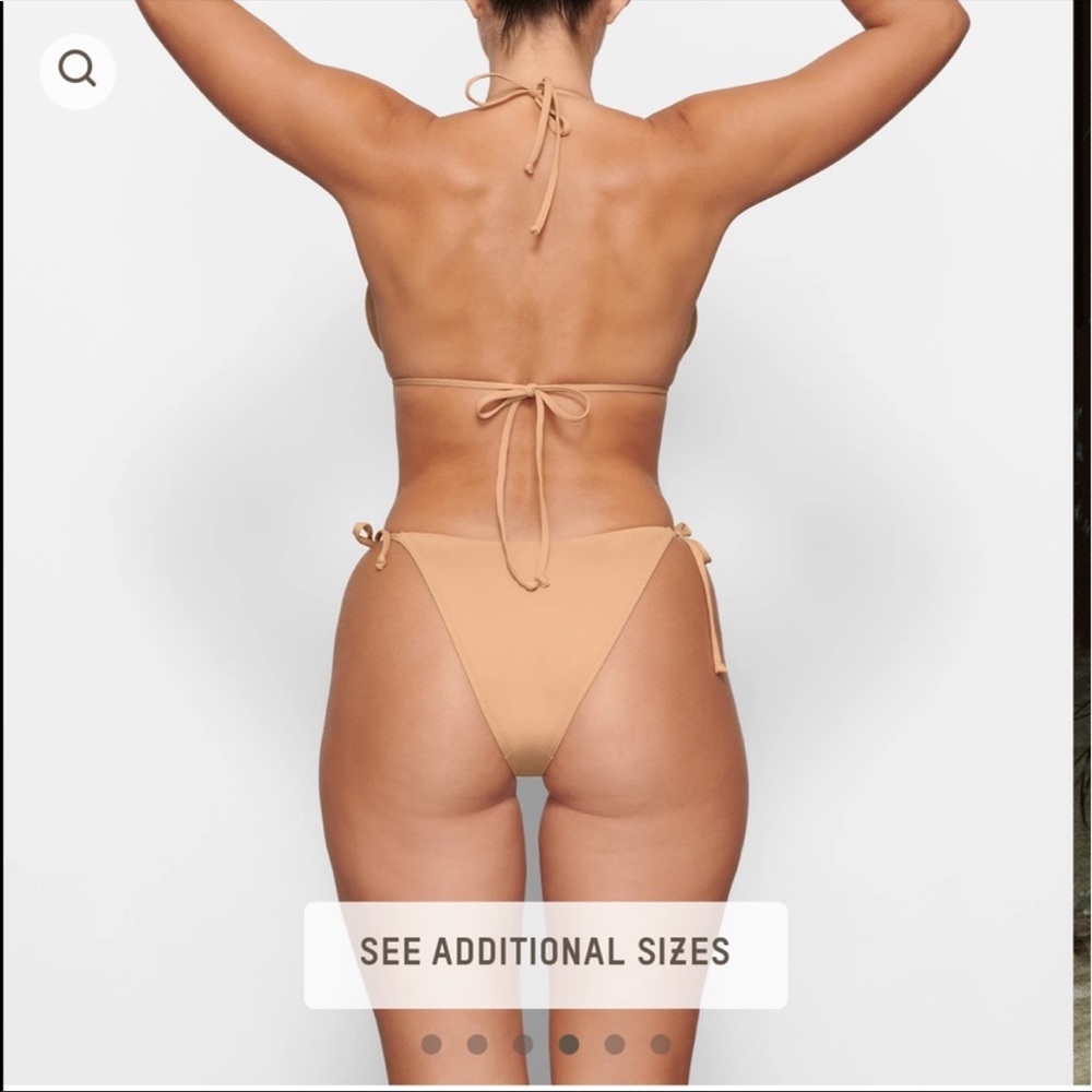 NWT. SKIMS bikini bottoms in OCHRE. Never warn. Came in too big.